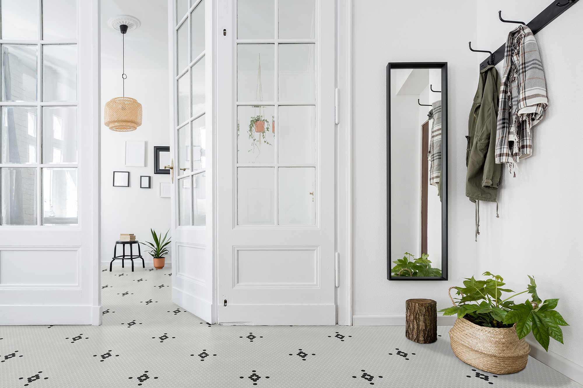 Spacious and stylish home interior with old glass door and wooden parquet